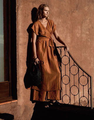 Model wearing the ELK Jopa Dress in rich copper — a contemporary design from ELK The Label, available online and in-store at Pink Poppies Living Creatively, Stanthorpe’s destination for Australian fashion.